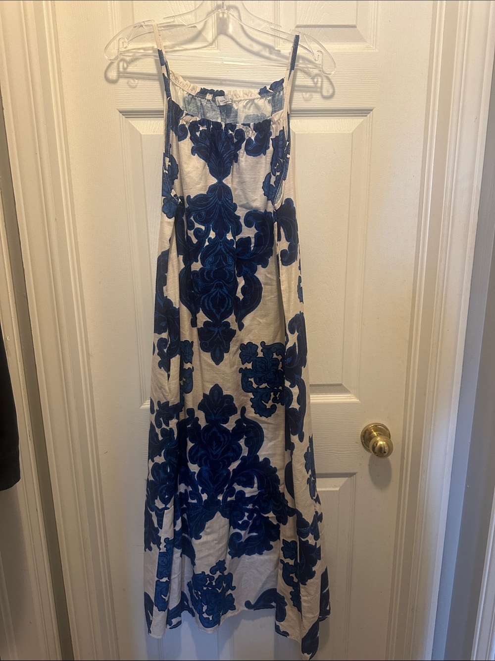 White Maxi Dress with Blue Floral Print and Spaghetti Straps